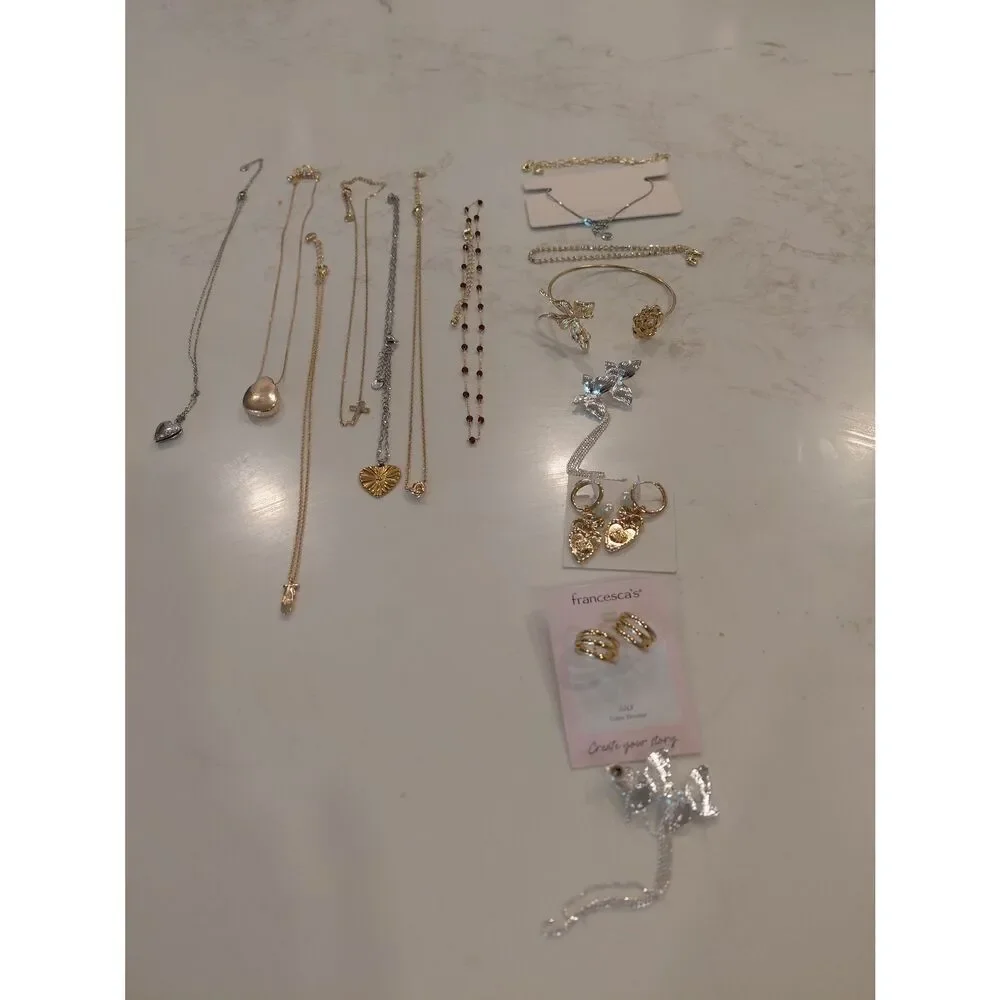4 sets of earrings, 4 bracelets, and 7 necklaces which are all new.